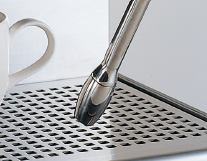 Folded nozzles allow dispensing to decanters.